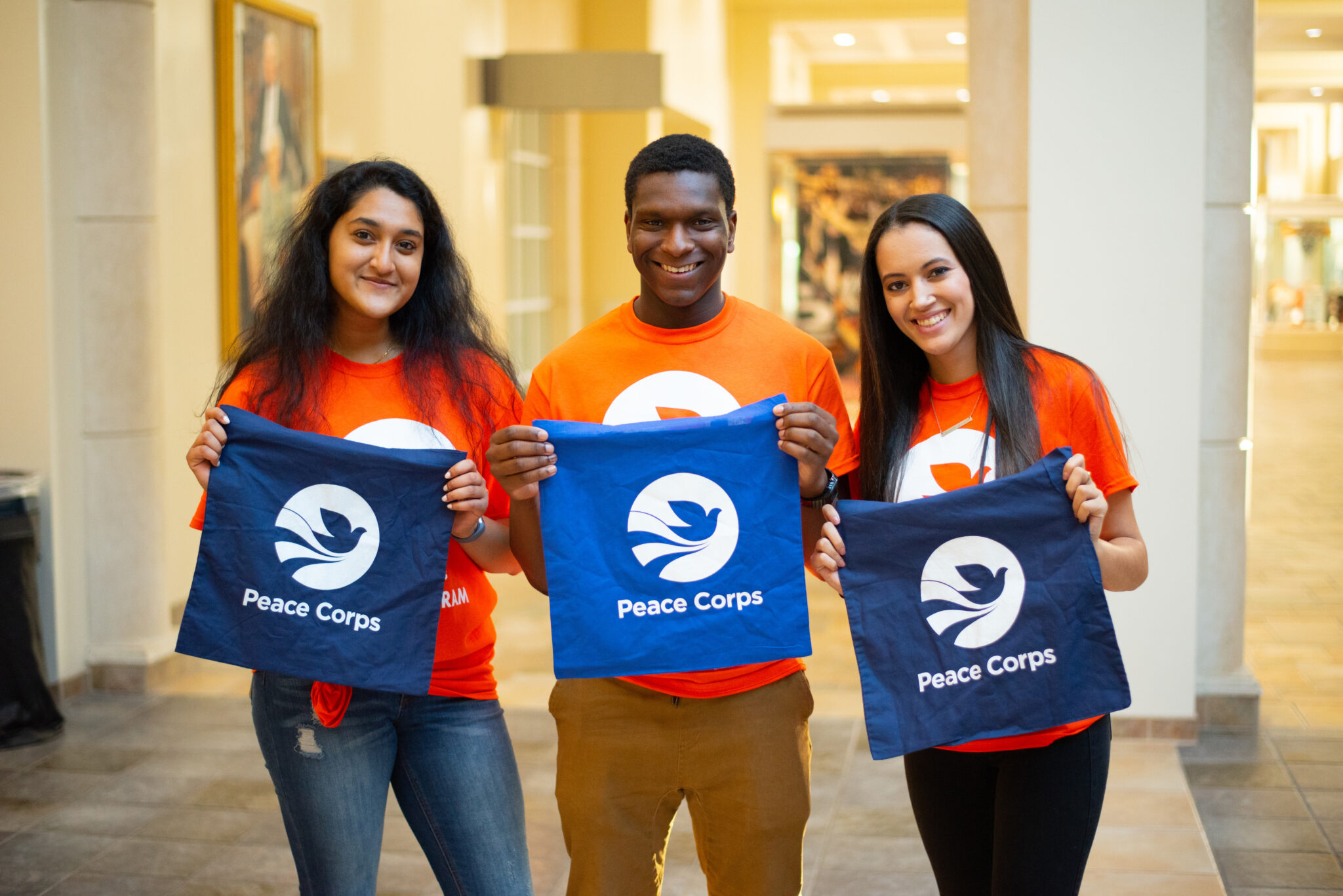 Photo of three Peace Corps prep Students in their PCP gear