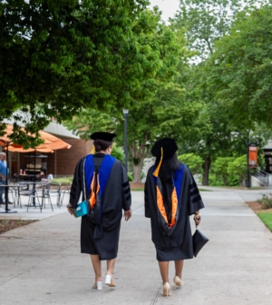 Two recently graduated College of Professional Advancement students