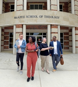 Group of students walking out of Theology school building