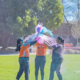 Students throwing colors at Holi