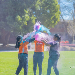 Students throwing colors at Holi