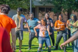 Student dancing at Holi