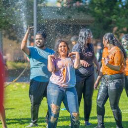 Student dancing at Holi