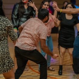 Students dancing at GloBears