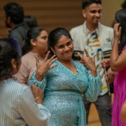 Student dancing at GloBears