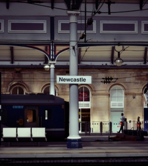 Train station with the sign for Newcastle