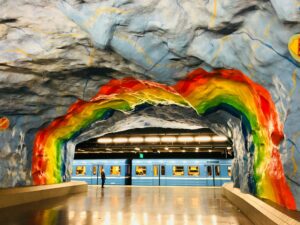 Rainbow over a tunnel painted on in a subway station